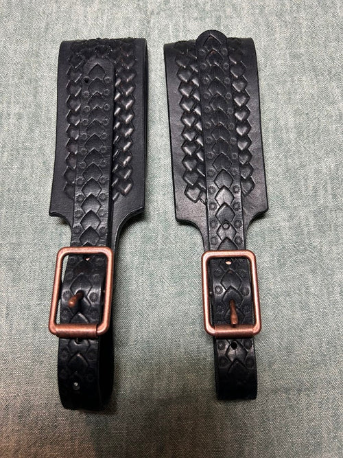 Two black diamond scale leather tankard straps with copper buckles, side by side
